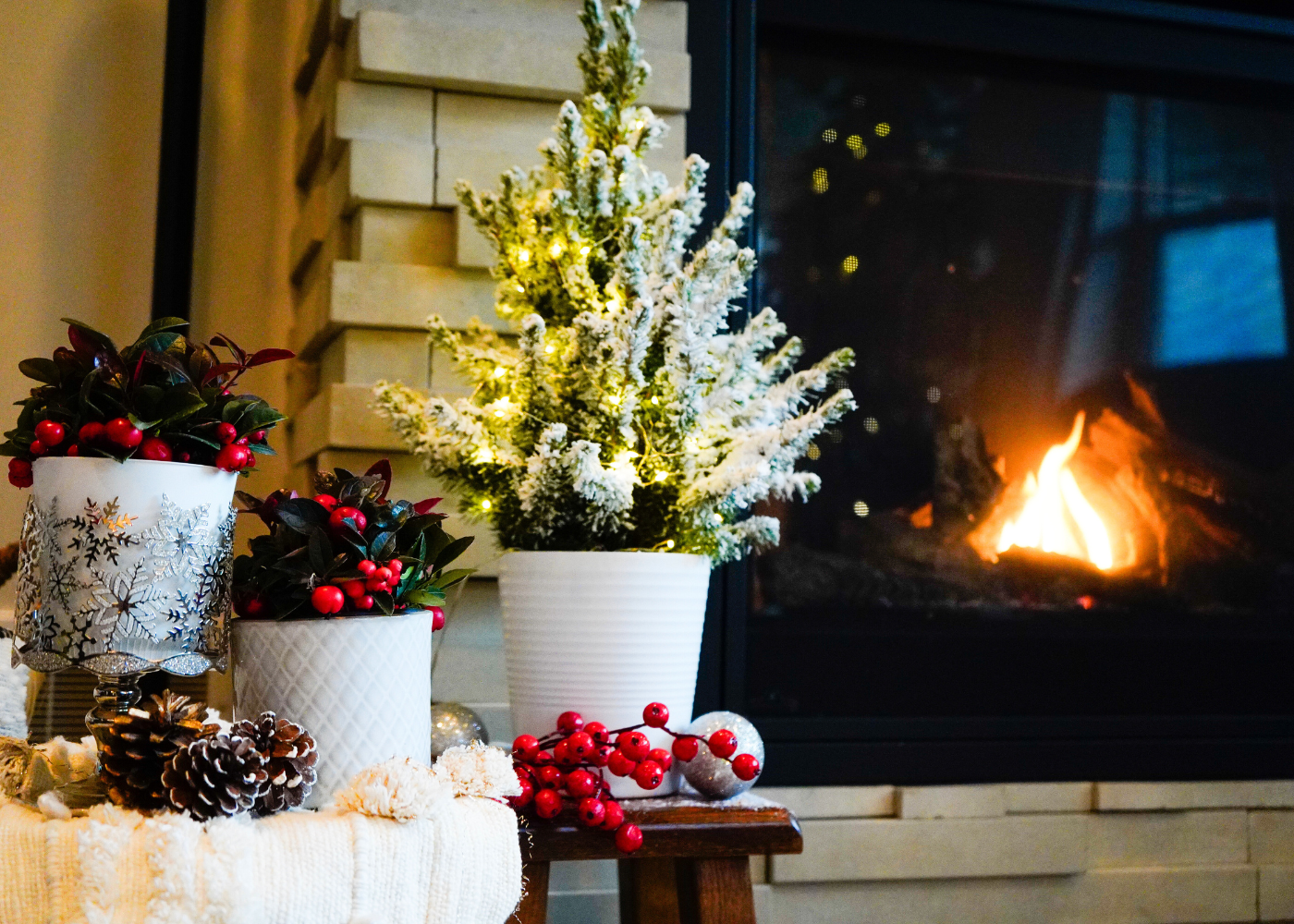 Flocked mini spruce and wintergreen berries in a Christmas living room